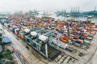 intermodal containers on dock by CHUTTERSNAP courtesy of Unsplash.