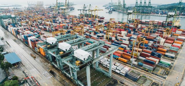 intermodal containers on dock by CHUTTERSNAP courtesy of Unsplash.